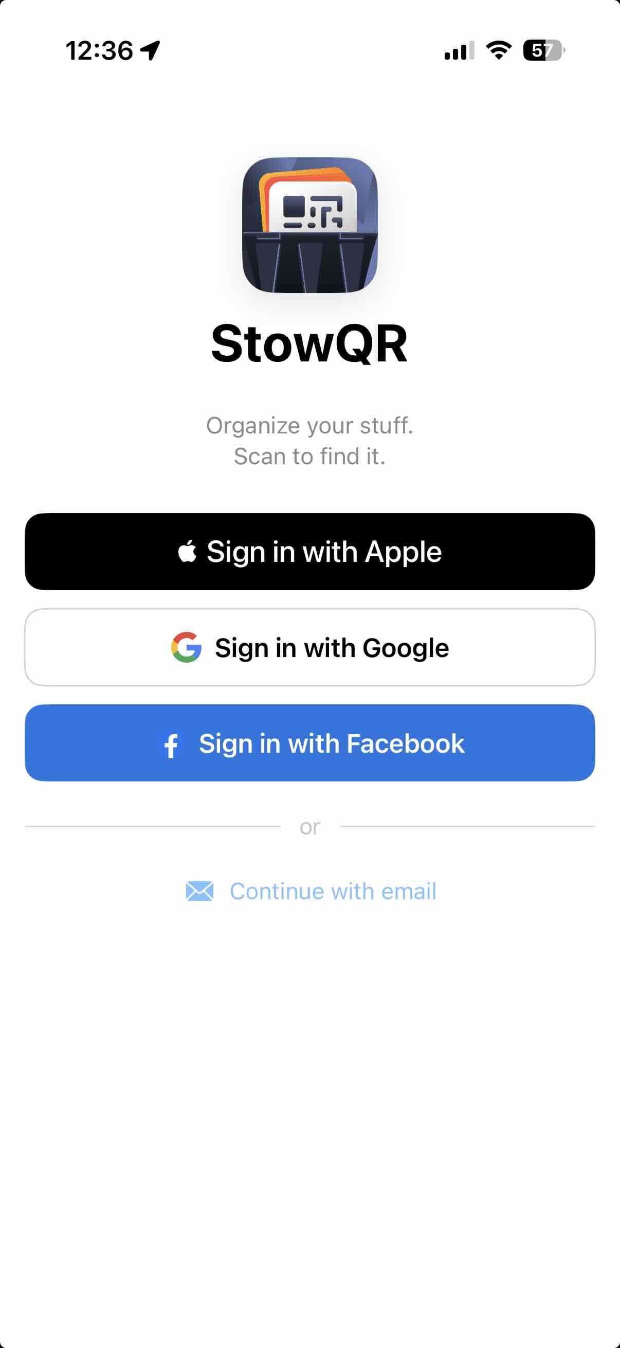 StowQR sign-in screen showing Apple, Google, and Facebook options