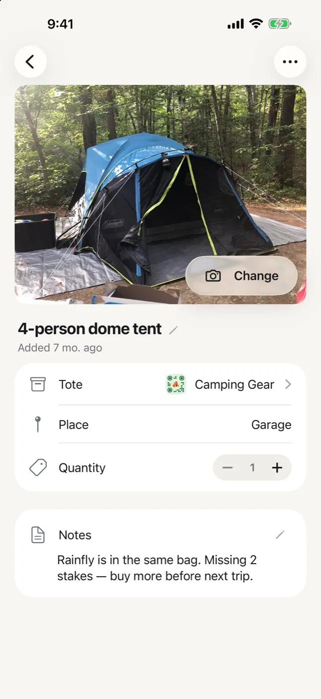 An item screen in StowQR on iPhone showing a tent photo, its tote and place, a quantity stepper and a notes field