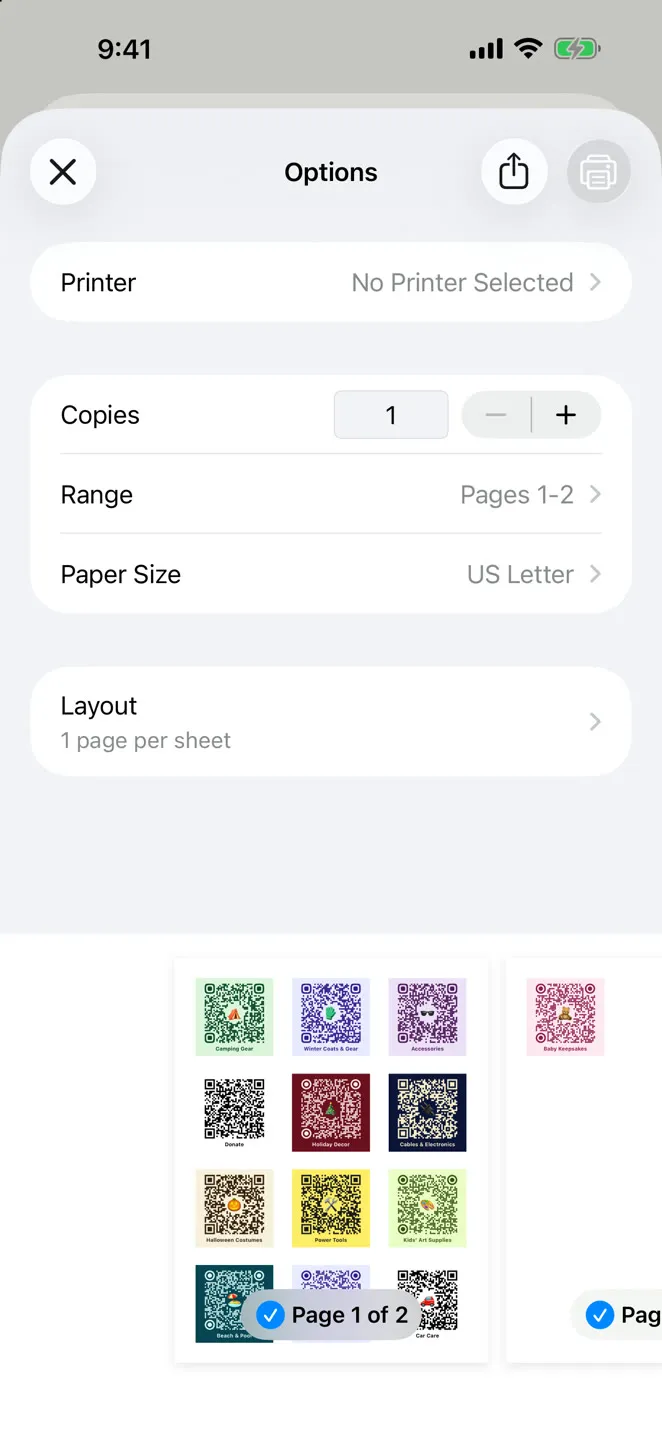 The iPhone print dialog in StowQR showing a sheet of twelve colorful QR labels